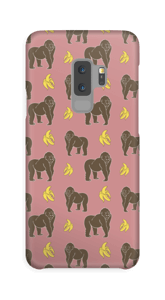 A case with monkeys and bananas in pink